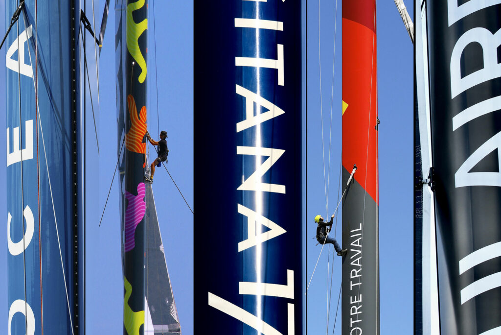View of several Ultim masts in port.